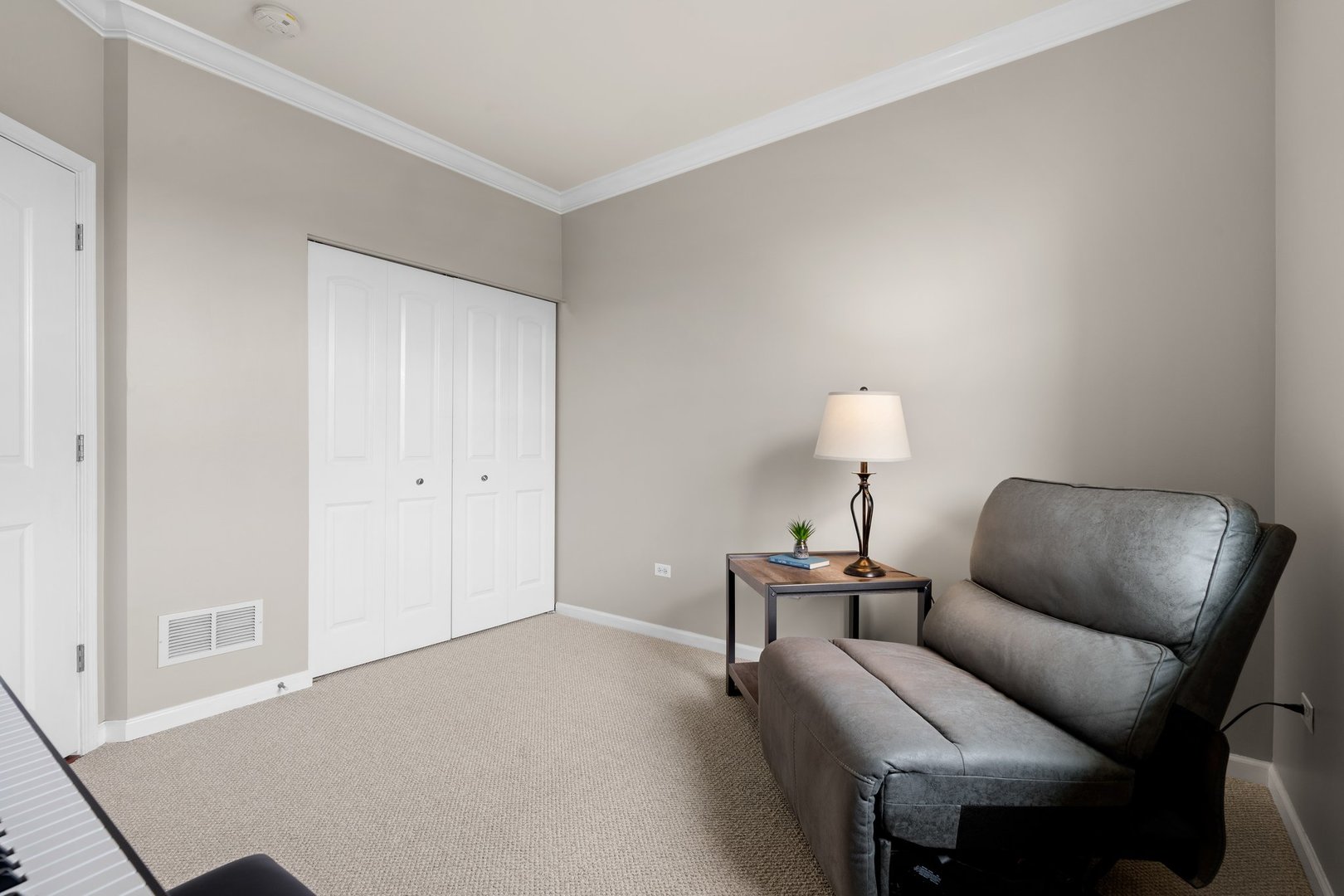 1116 Draper Road, Unit 1116 McHenry, IL 60050 - Photo 14 of 20 a room with furniture and a lamp on table