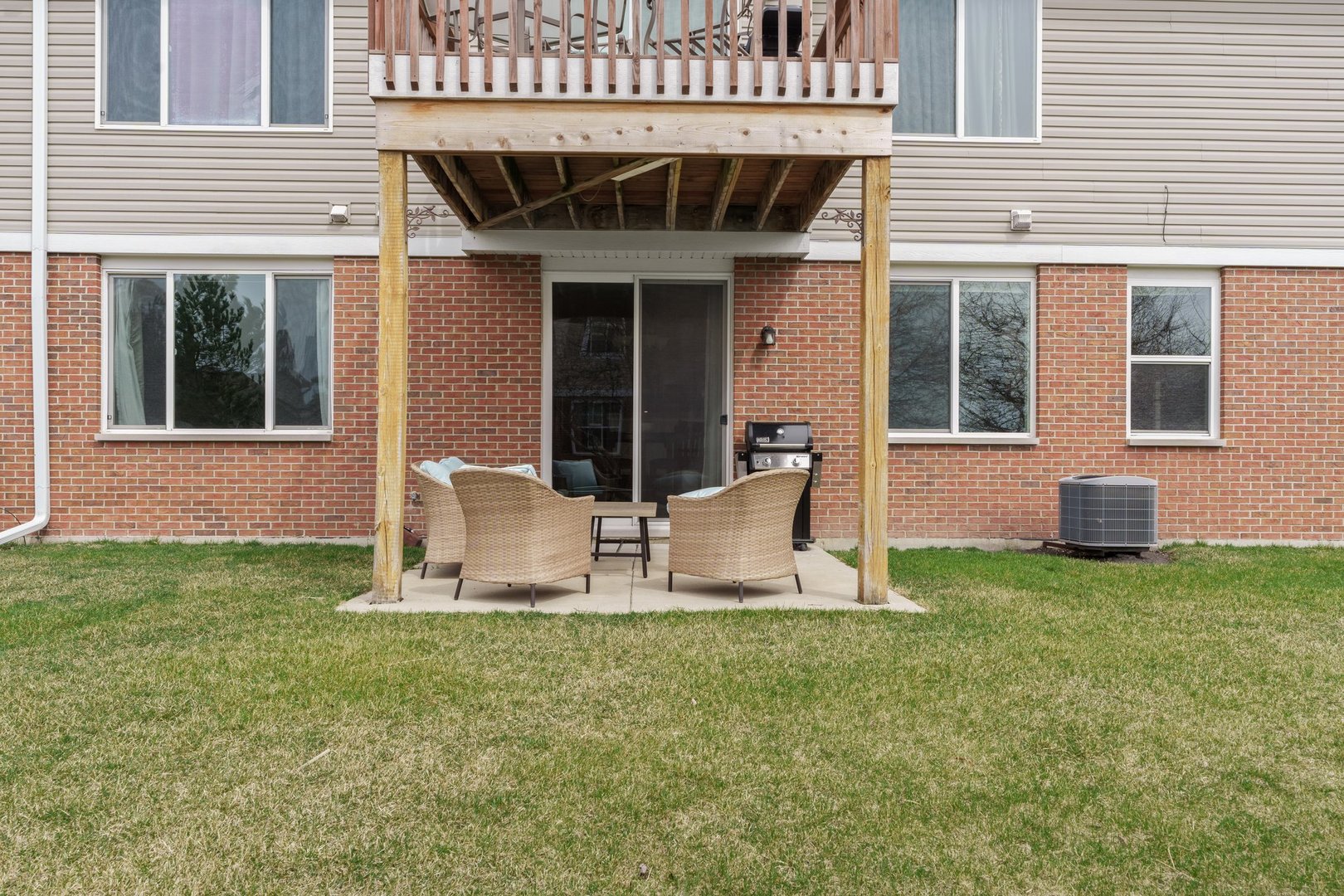 1116 Draper Road, Unit 1116 McHenry, IL 60050 - Photo 18 of 20 a front view of a house with garden
