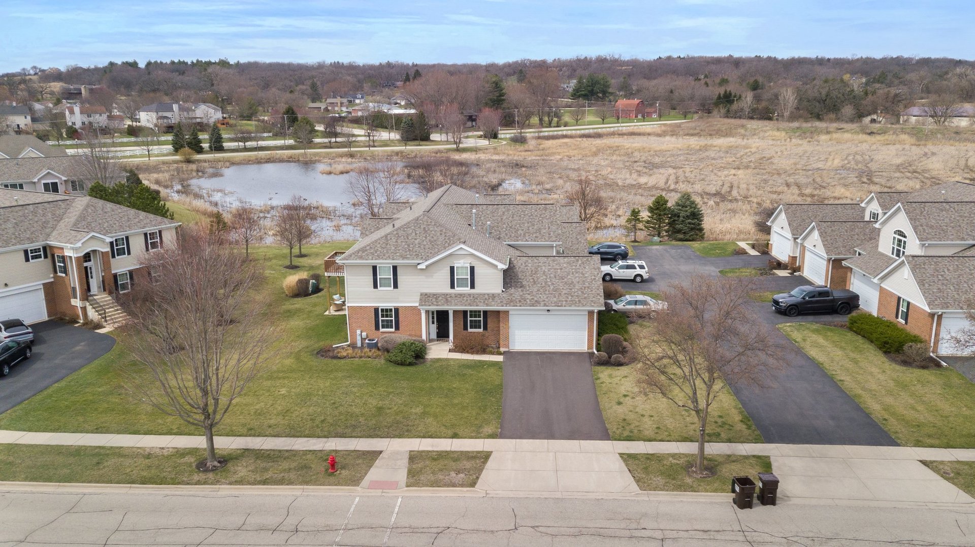 1116 Draper Road, Unit 1116 McHenry, IL 60050 - Photo 19 of 20 an aerial view of residential houses with outdoor space and river