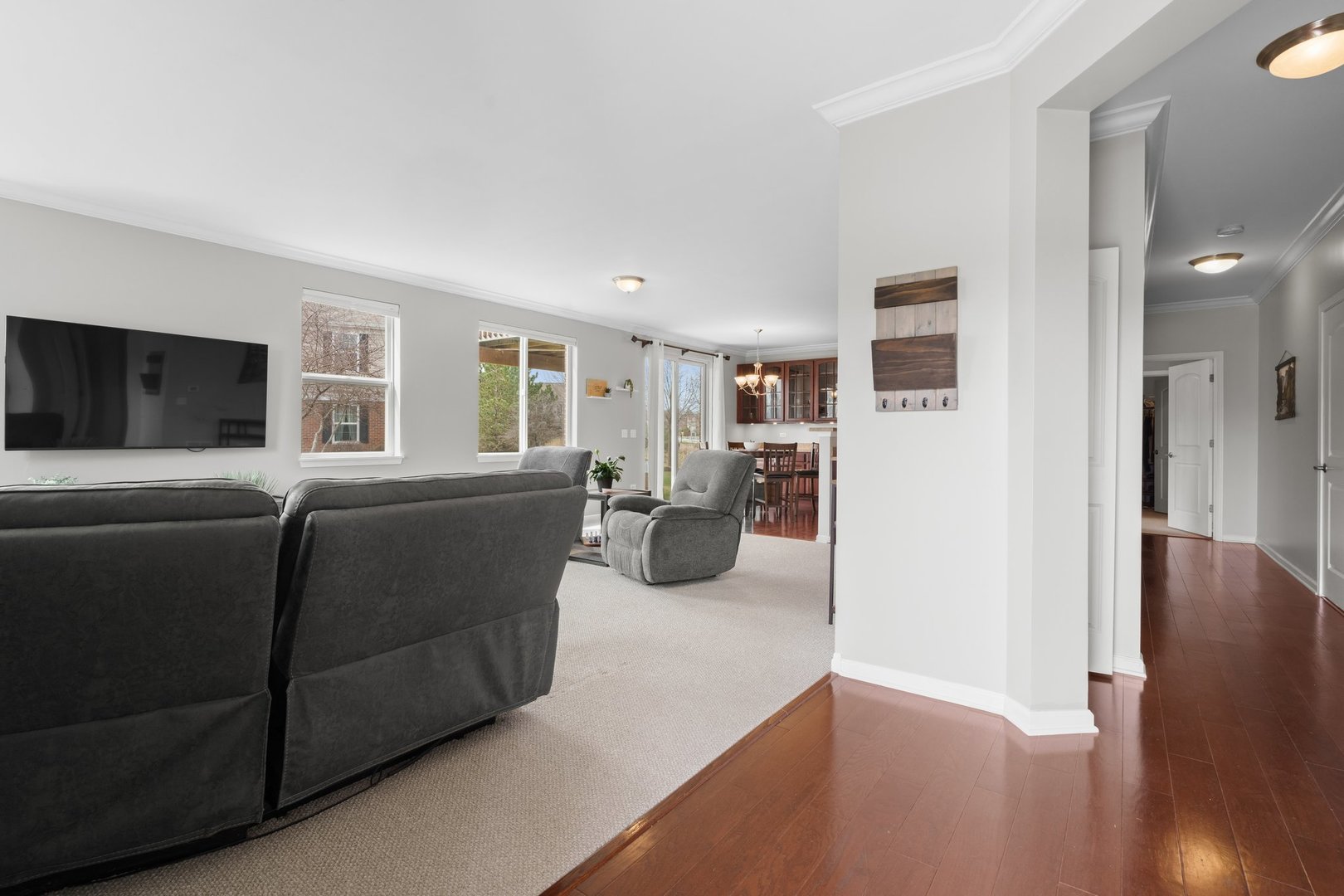 1116 Draper Road, Unit 1116 McHenry, IL 60050 - Photo 4 of 20 a living room with furniture window and wooden floor