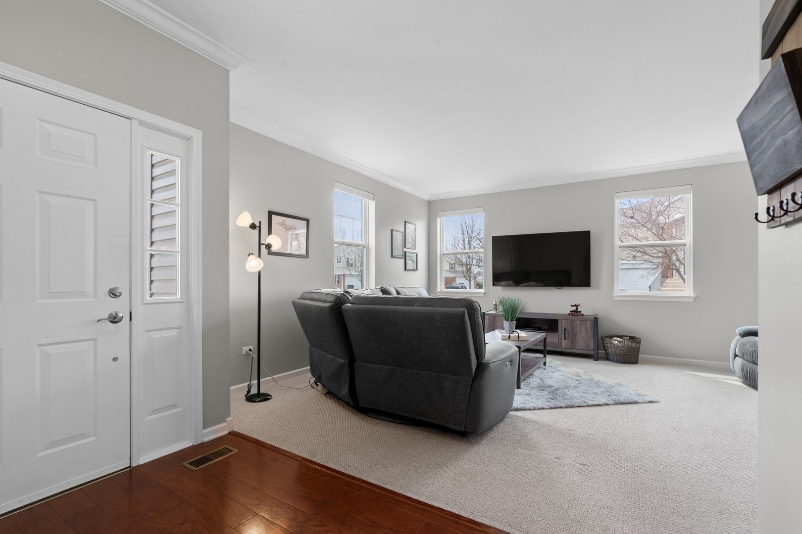 1116 Draper Road, Unit 1116 McHenry, IL 60050 - Photo 5 of 20 a living room with furniture and a flat screen tv