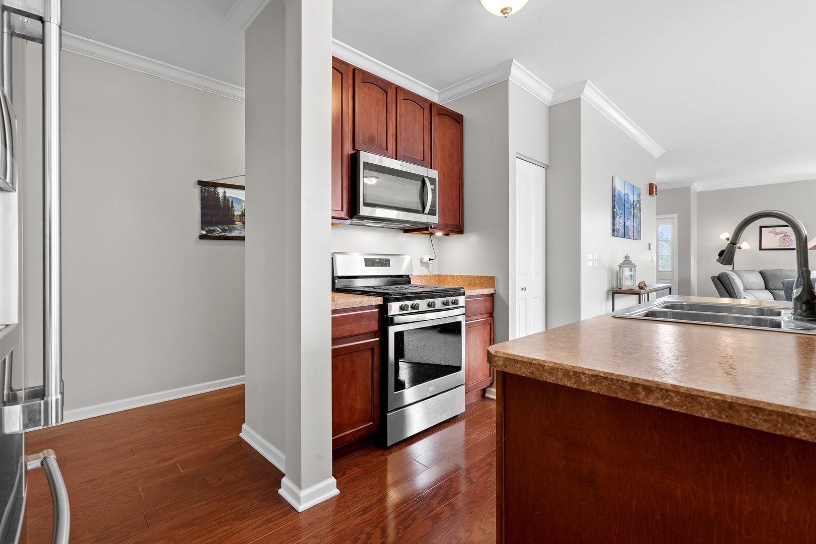1116 Draper Road, Unit 1116 McHenry, IL 60050 - Photo 9 of 20 a kitchen with granite countertop a stove and a sink