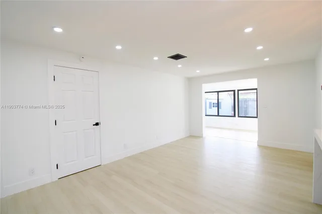 a view of an empty room with a large window