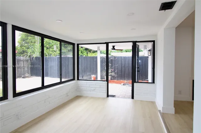 a view of an empty room with a window