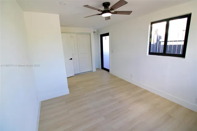 a bathroom with a toilet a sink and a mirror