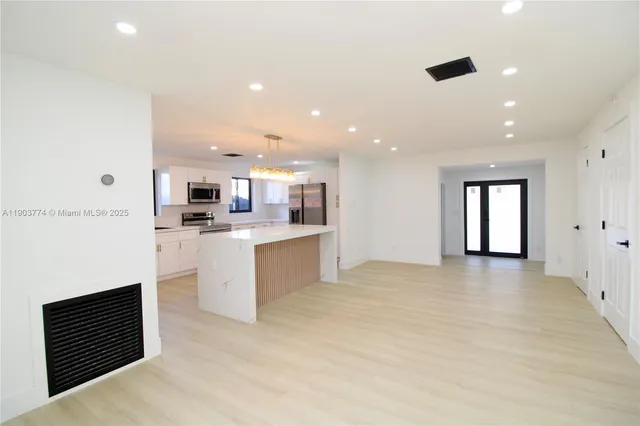 a view of a kitchen with cabinets