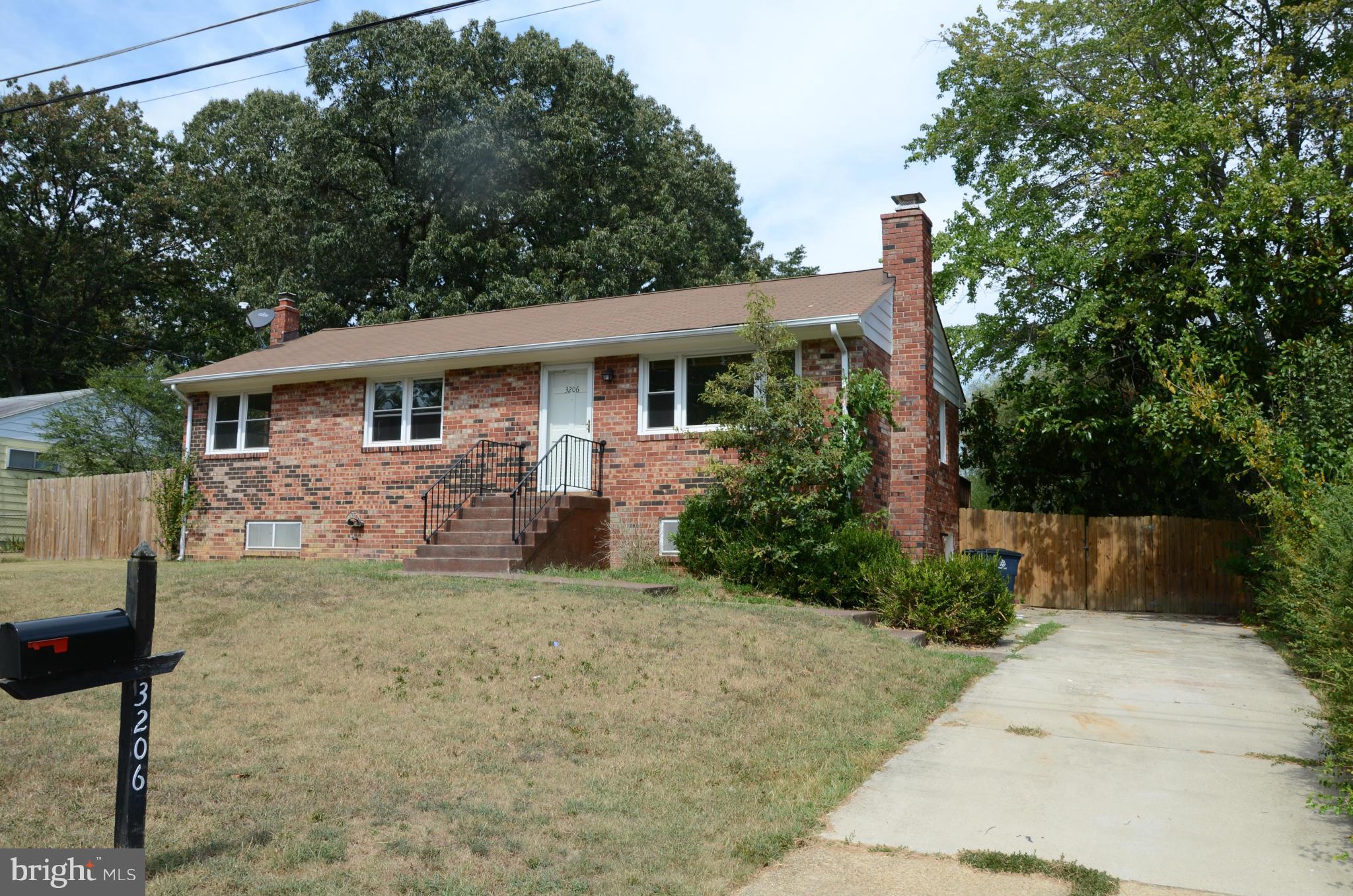 3206 Dalewood Road Fort Washington, MD 20744 - Photo 1 of 18 a front view of a house with garden