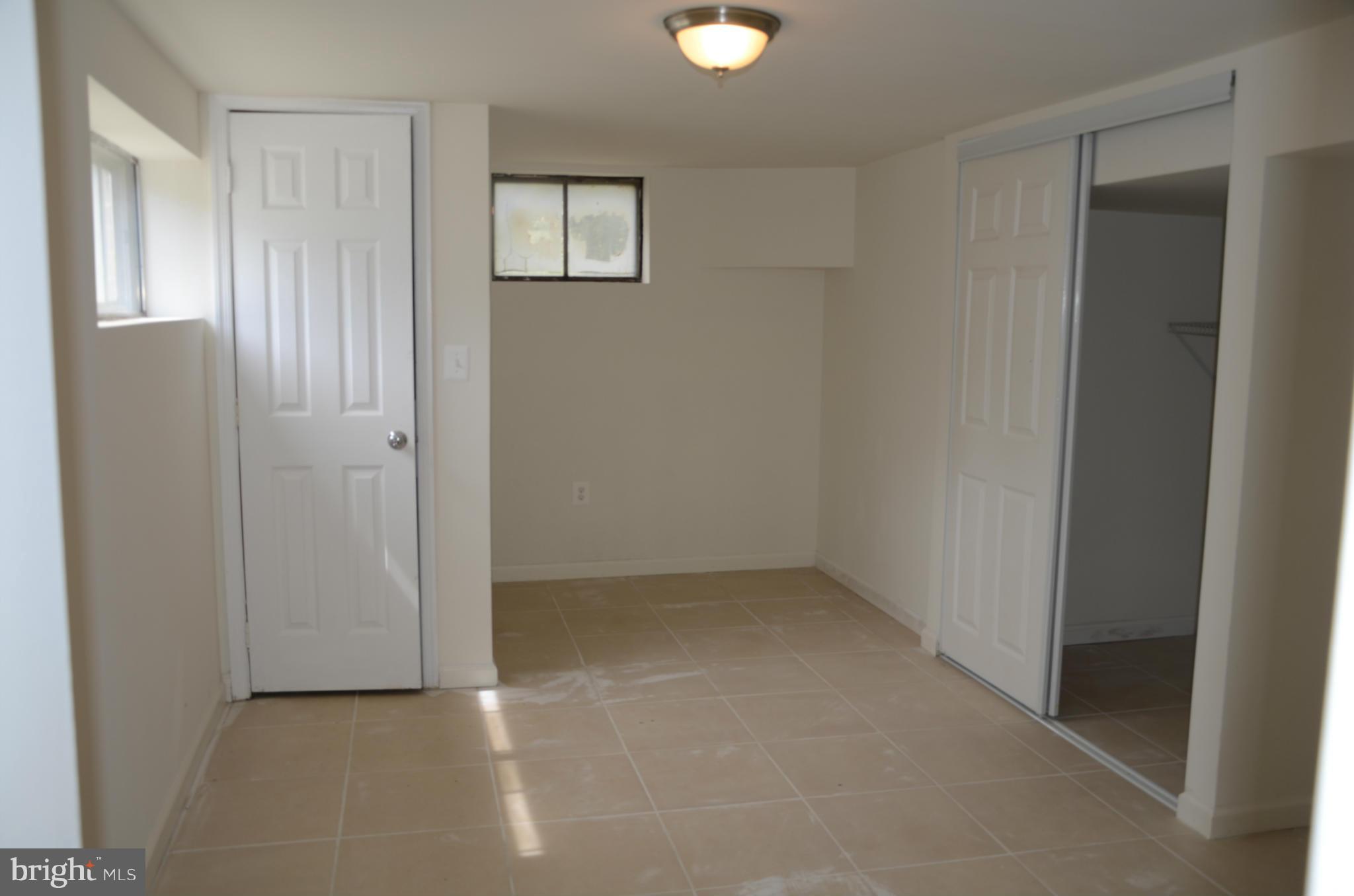 3206 Dalewood Road Fort Washington, MD 20744 - Photo 12 of 18 an empty room with windows