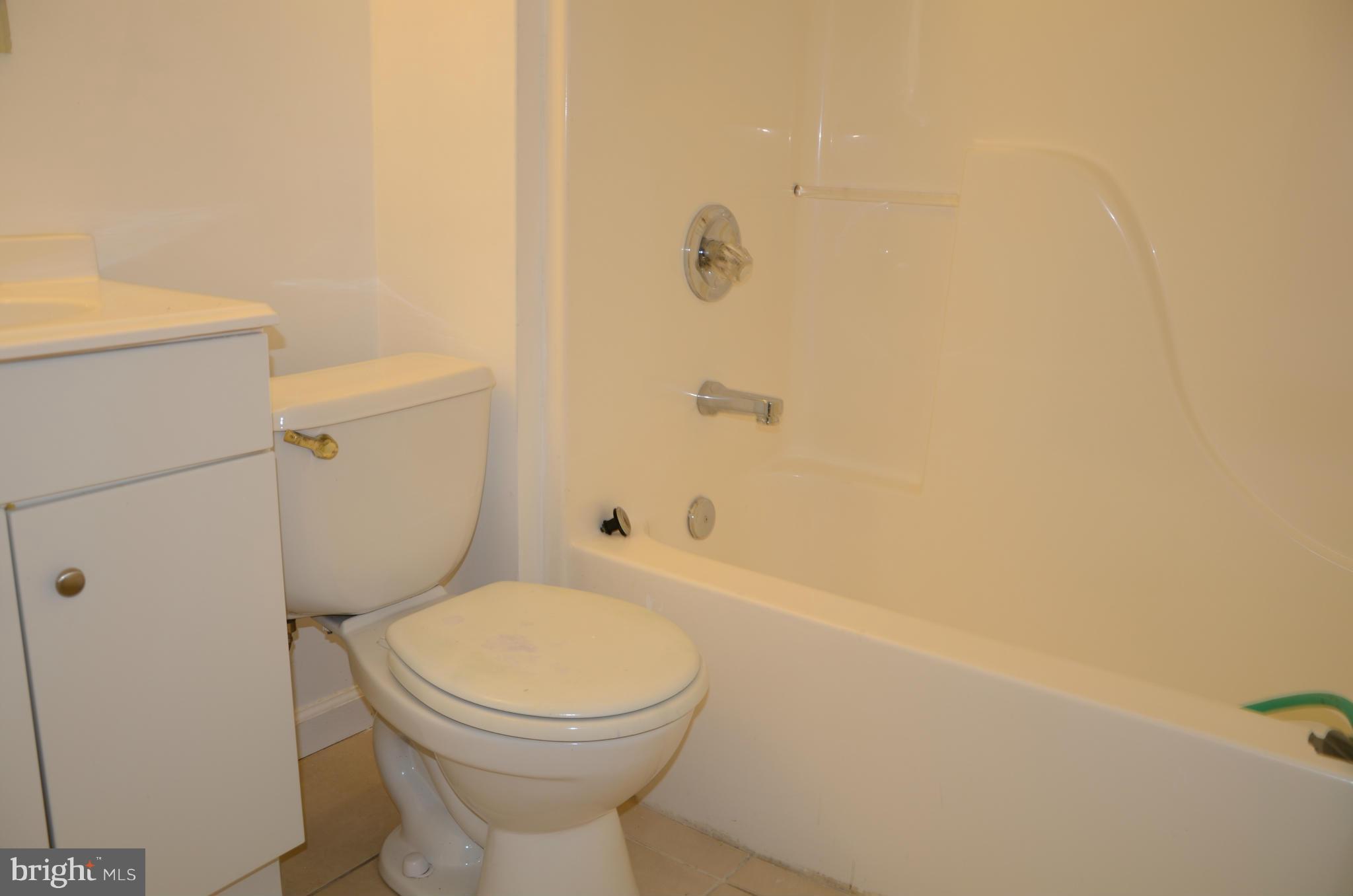 3206 Dalewood Road Fort Washington, MD 20744 - Photo 13 of 18 a white toilet sitting next to a bath tub