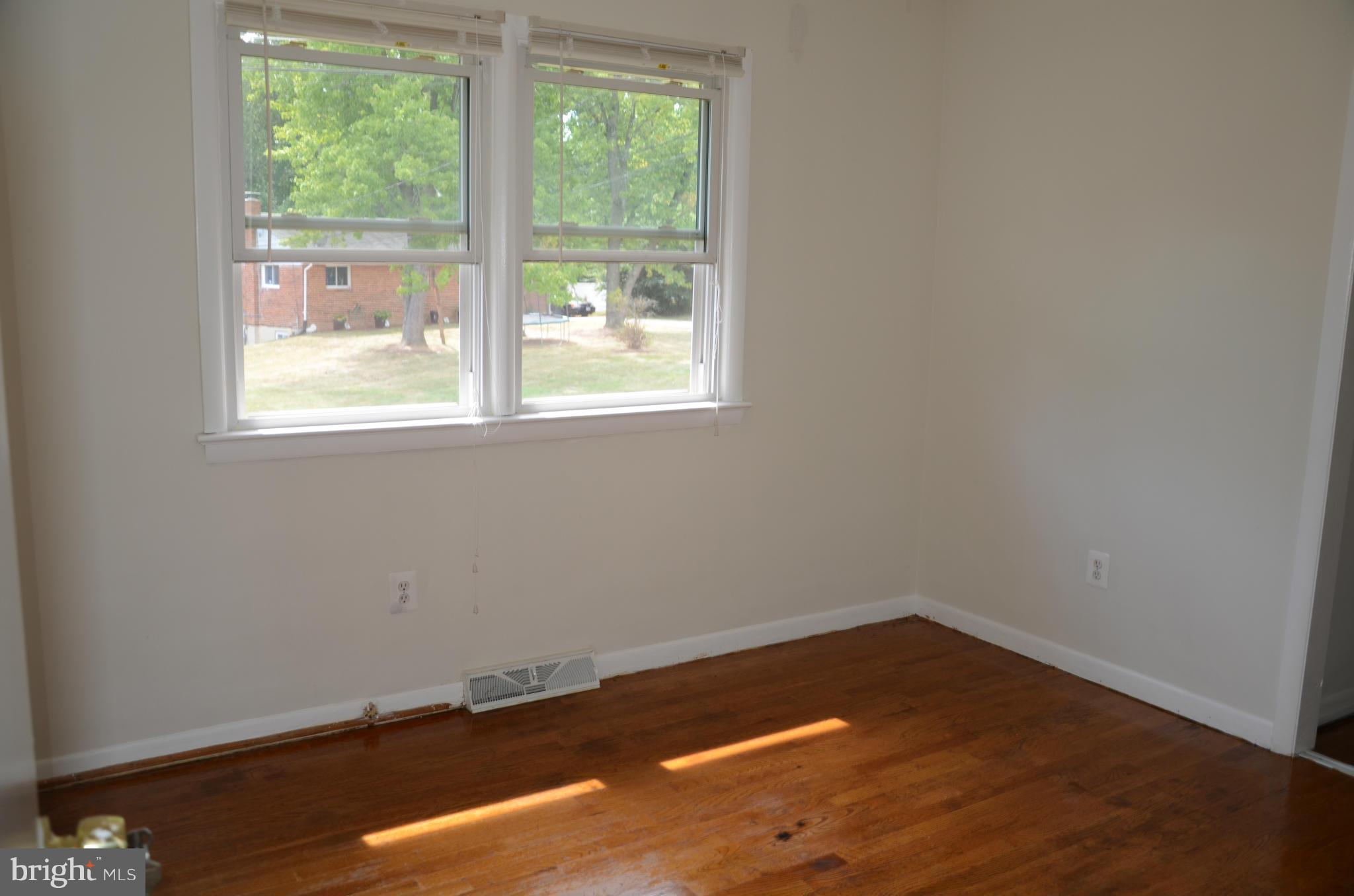 3206 Dalewood Road Fort Washington, MD 20744 - Photo 6 of 18 an empty room with wooden floor and windows