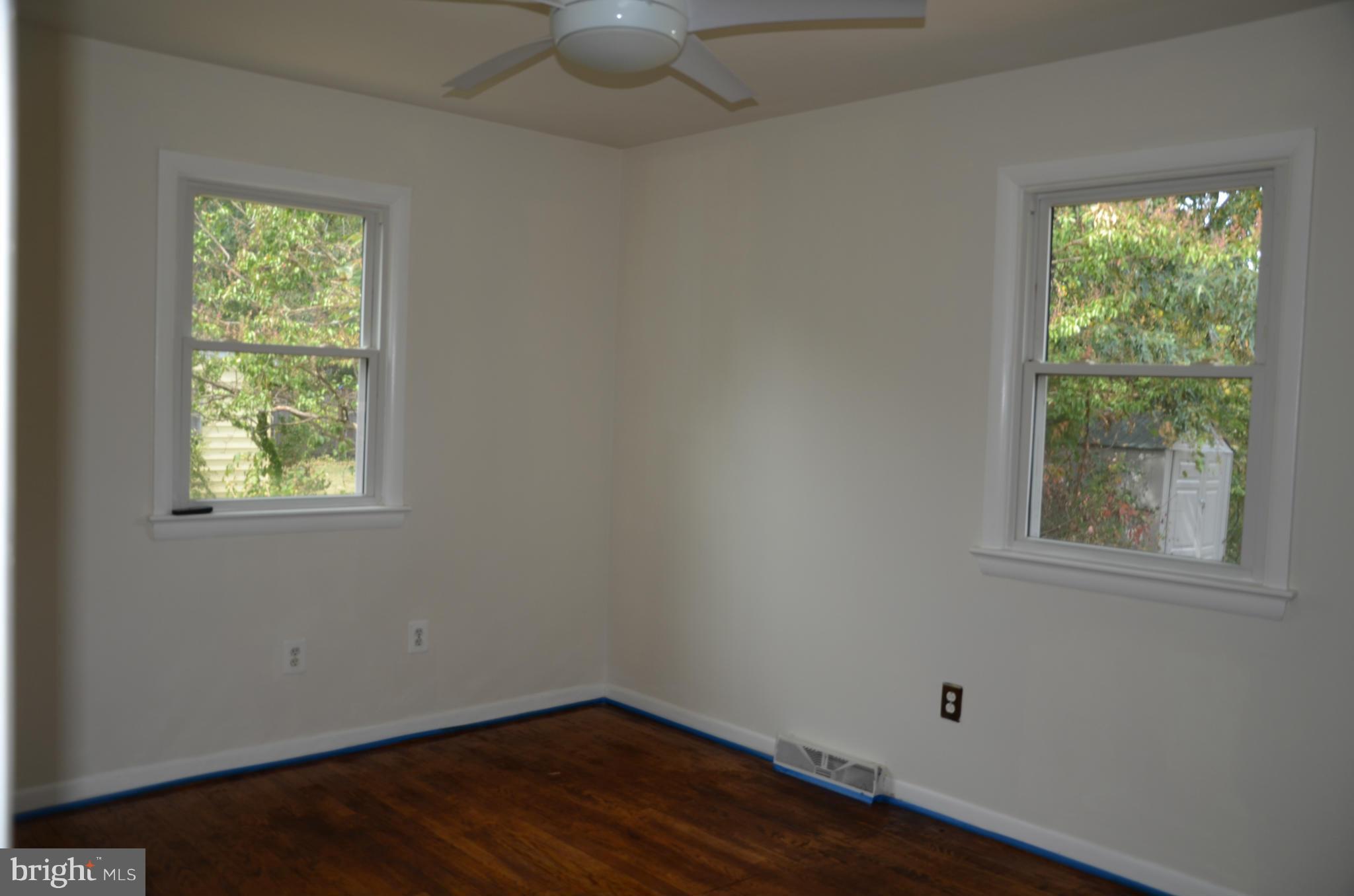 3206 Dalewood Road Fort Washington, MD 20744 - Photo 8 of 18 an empty room with wooden floor and windows