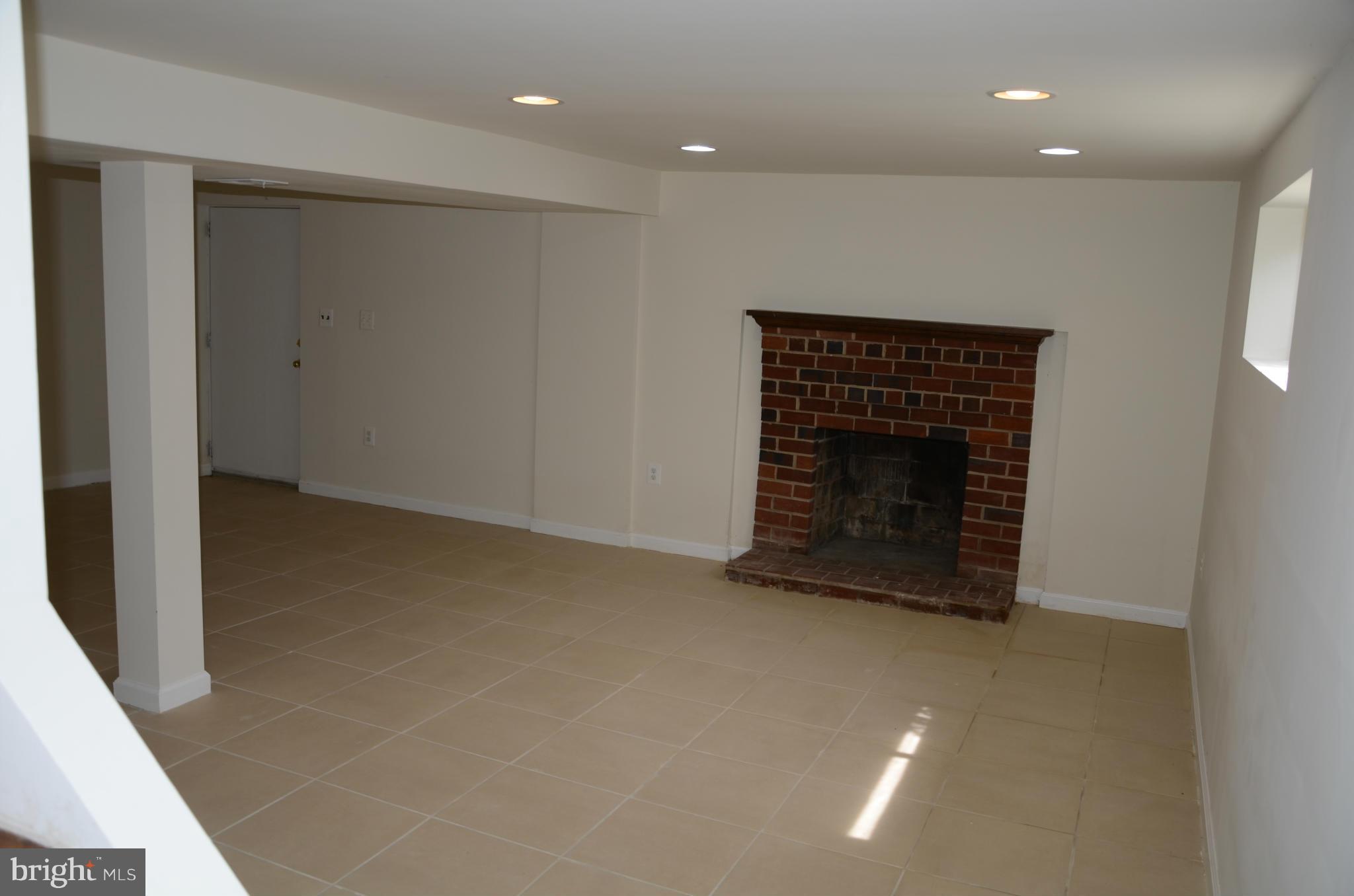 3206 Dalewood Road Fort Washington, MD 20744 - Photo 10 of 18 a view of an empty room with a fireplace
