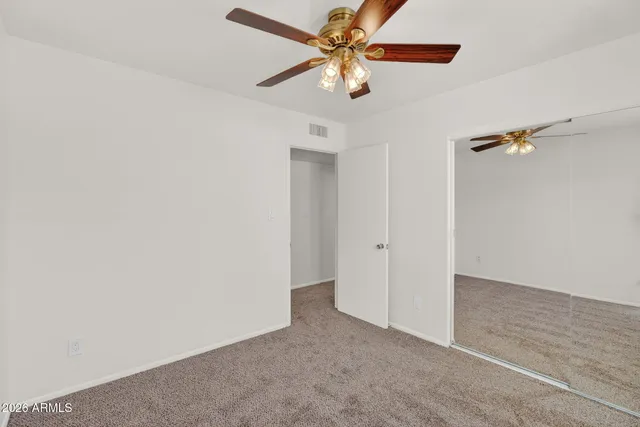 a view of a ceiling fan in a room