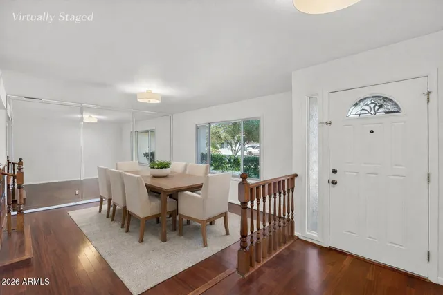 a view of a dining room with furniture window and wooden floor