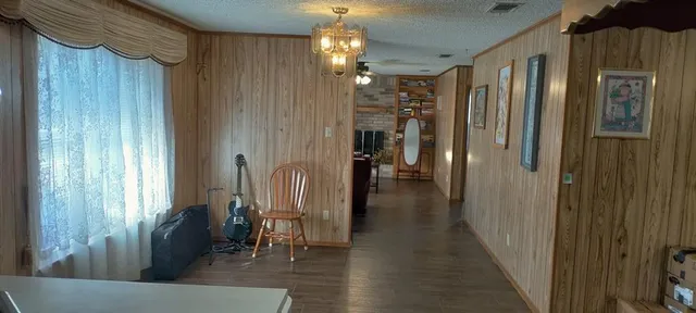 a view of a kitchen with a sink and cabinets