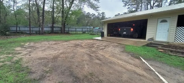 a view of a house with backyard tub and sitting area