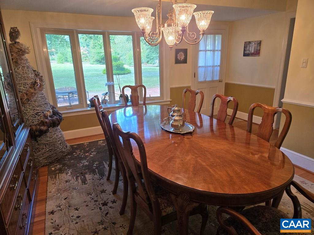 701 4th Avenue Farmville, VA 23901 - Photo 5 of 29 a view of a dining room with furniture a chandelier and large windows