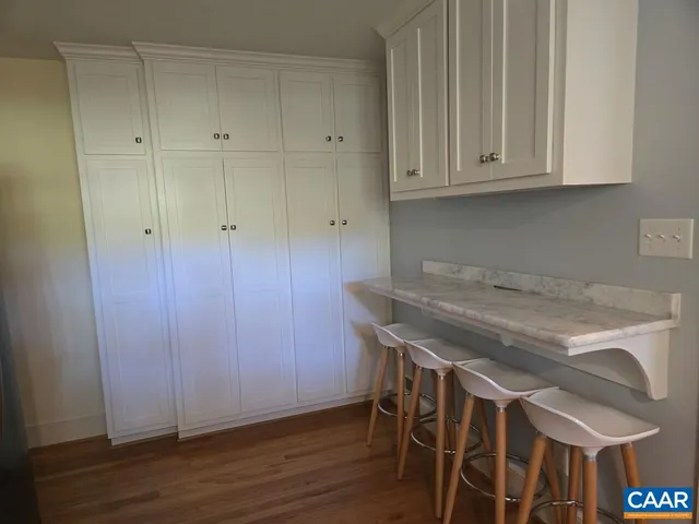 a view of a dining area with wooden floor