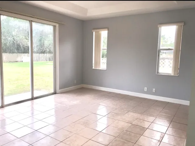 a view of an empty room and window