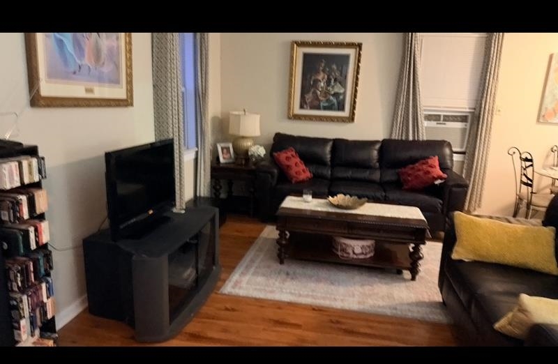 476 Jenson Road Memphis, TN 38109 - Photo 14 of 17 Living room featuring wood finished floors and cooling unit