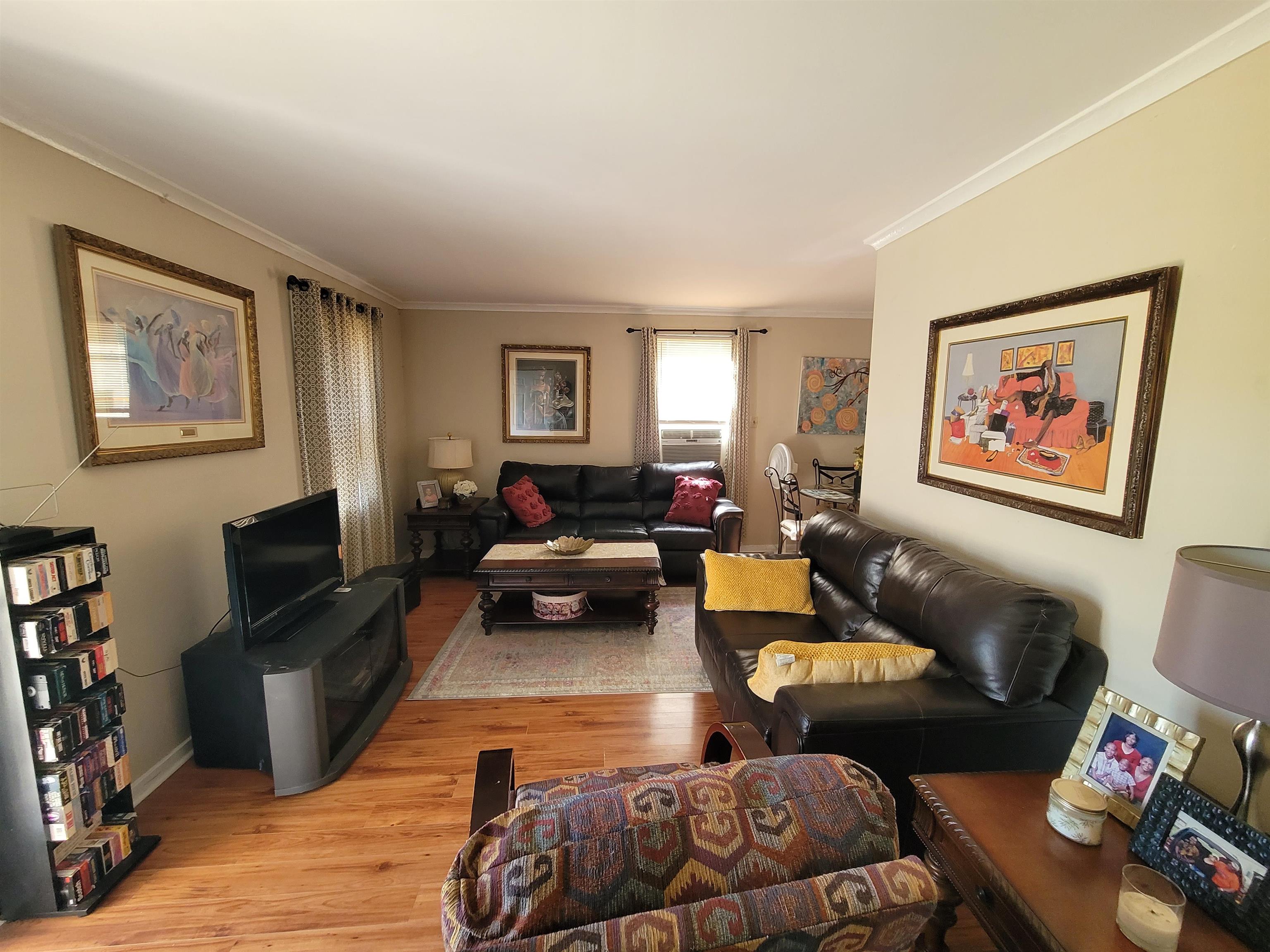 476 Jenson Road Memphis, TN 38109 - Photo 18 of 30 a living room with furniture and a flat screen tv