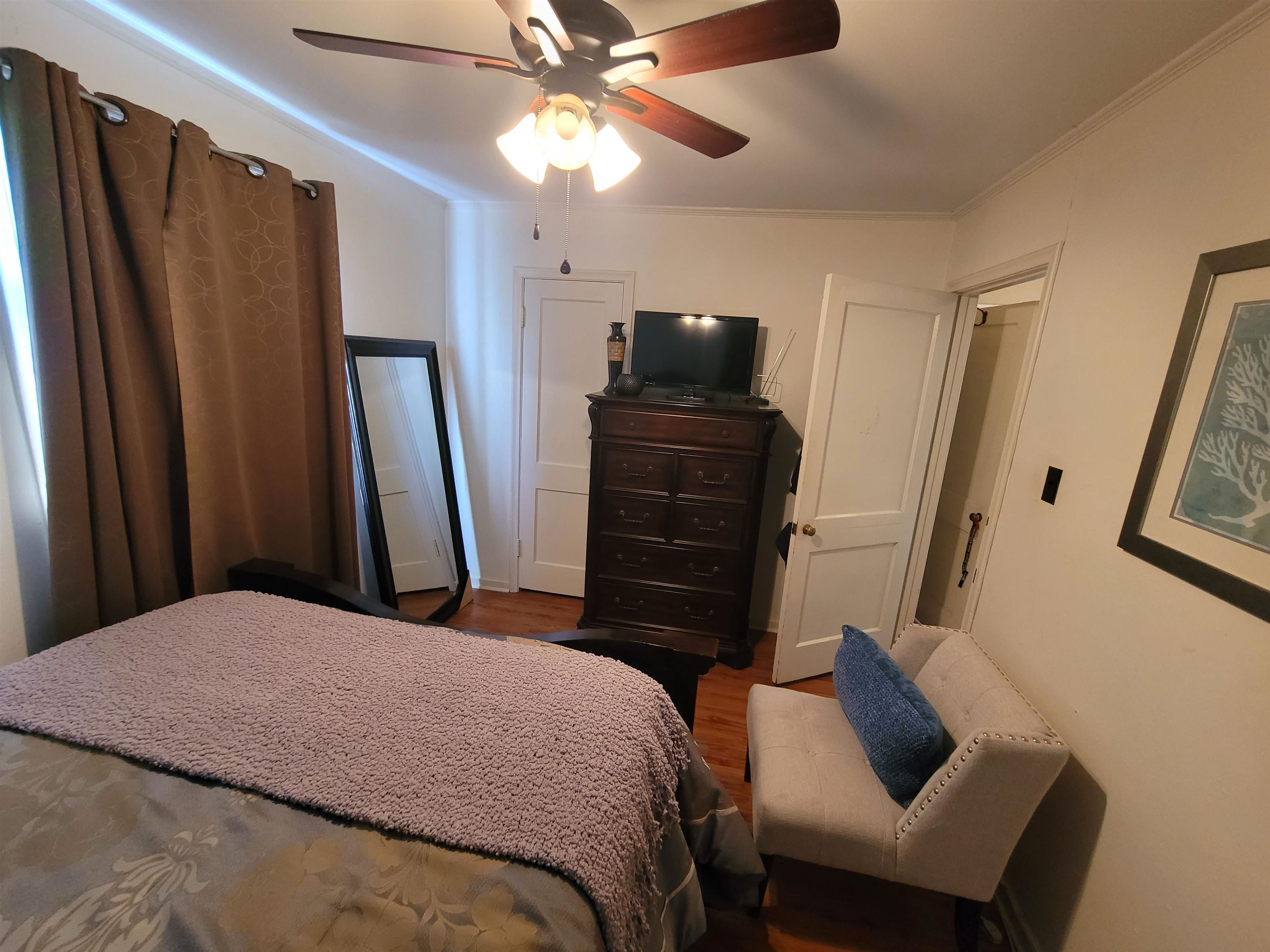 476 Jenson Road Memphis, TN 38109 - Photo 28 of 30 a bedroom with a bed and a flat screen tv