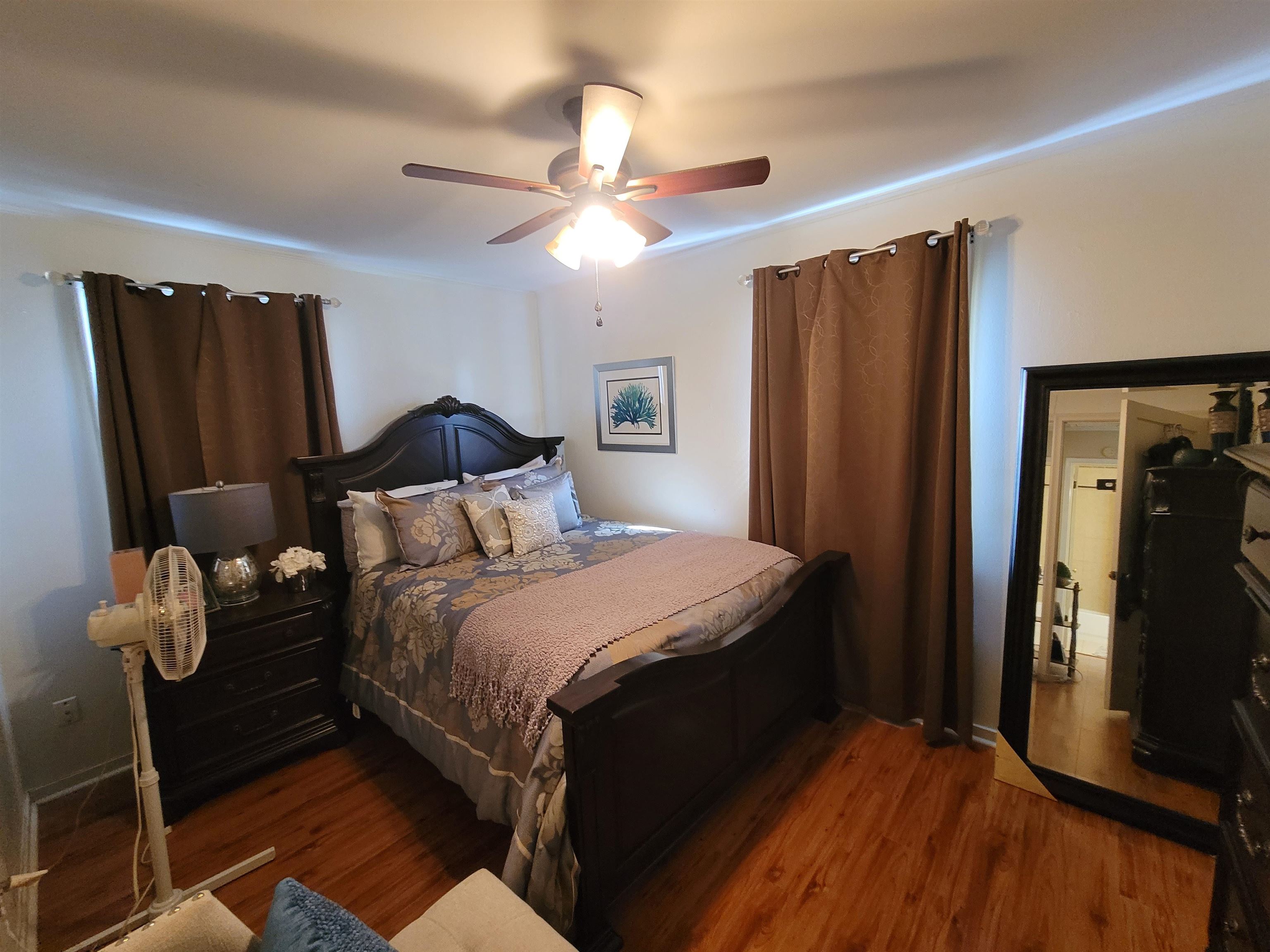 476 Jenson Road Memphis, TN 38109 - Photo 29 of 30 a bedroom with a bed and wooden floor
