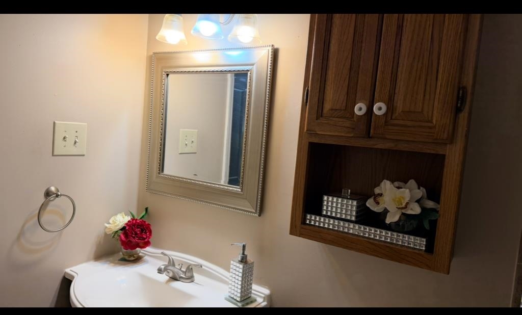 476 Jenson Road Memphis, TN 38109 - Photo 8 of 30 a bathroom with a sink and mirror