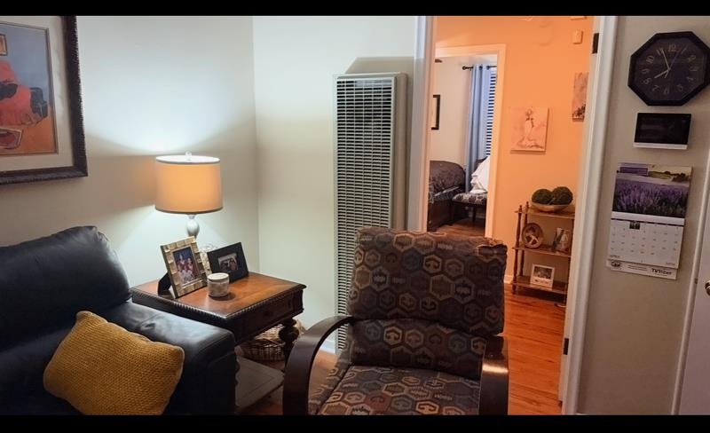 476 Jenson Road Memphis, TN 38109 - Photo 10 of 17 Living area featuring a heating unit and wood finished floors