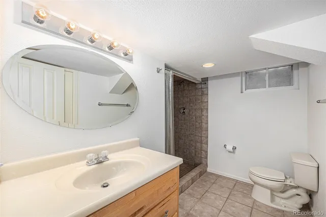 a view of a porch with furniture and floor to ceiling window