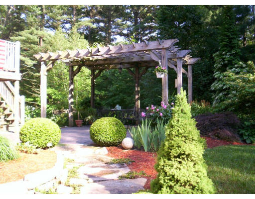 9 Potter Road Douglas, MA 01516 - Photo 19 of 26 a view of a patio with table and chairs potted plants