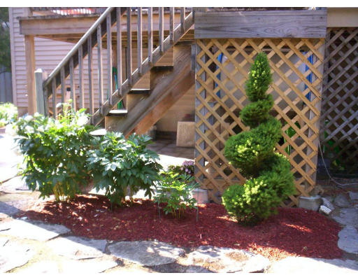 9 Potter Road Douglas, MA 01516 - Photo 22 of 26 a view of a pathway with a flower plants