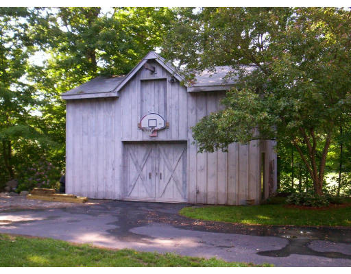 9 Potter Road Douglas, MA 01516 - Photo 6 of 26 a front view of a house with garden