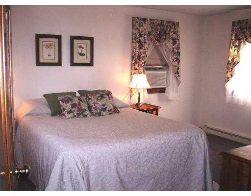 9 Potter Road Douglas, MA 01516 - Photo 7 of 26 a bedroom with a bed and a window