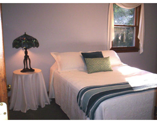 9 Potter Road Douglas, MA 01516 - Photo 8 of 26 a bedroom with a bed and a painting on the wall