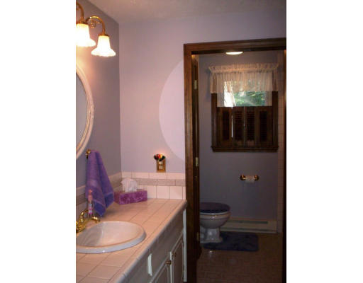 9 Potter Road Douglas, MA 01516 - Photo 10 of 26 a bathroom with a sink and a mirror