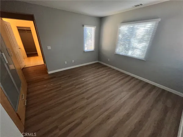 a bathroom with a double vanity sink and mirror