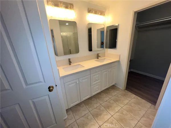 a bathroom with a glass door shower