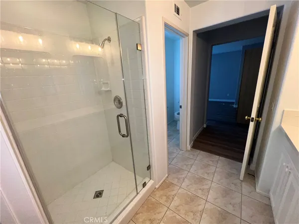 a view of a room with shelf on the wall