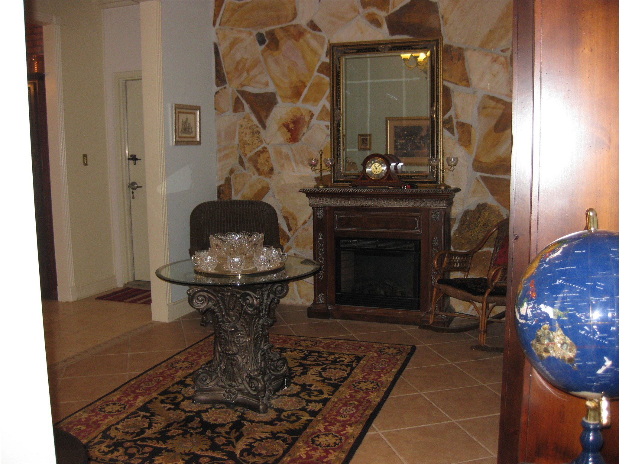 29315 Stockdick Road Katy, TX 77493 - Photo 12 of 50 a living room with a table and a fireplace