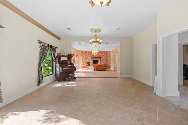 a dining room with furniture and chandelier or kitchen view