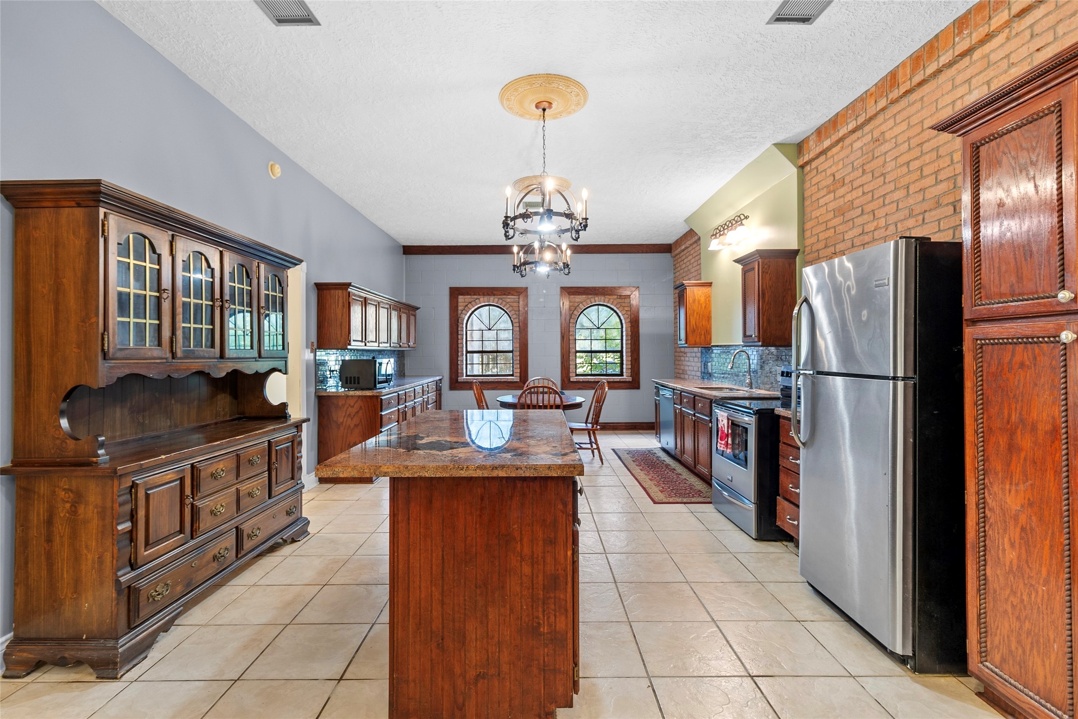 29315 Stockdick Road Katy, TX 77493 - Photo 23 of 50 a kitchen with stainless steel appliances granite countertop a stove refrigerator and cabinets