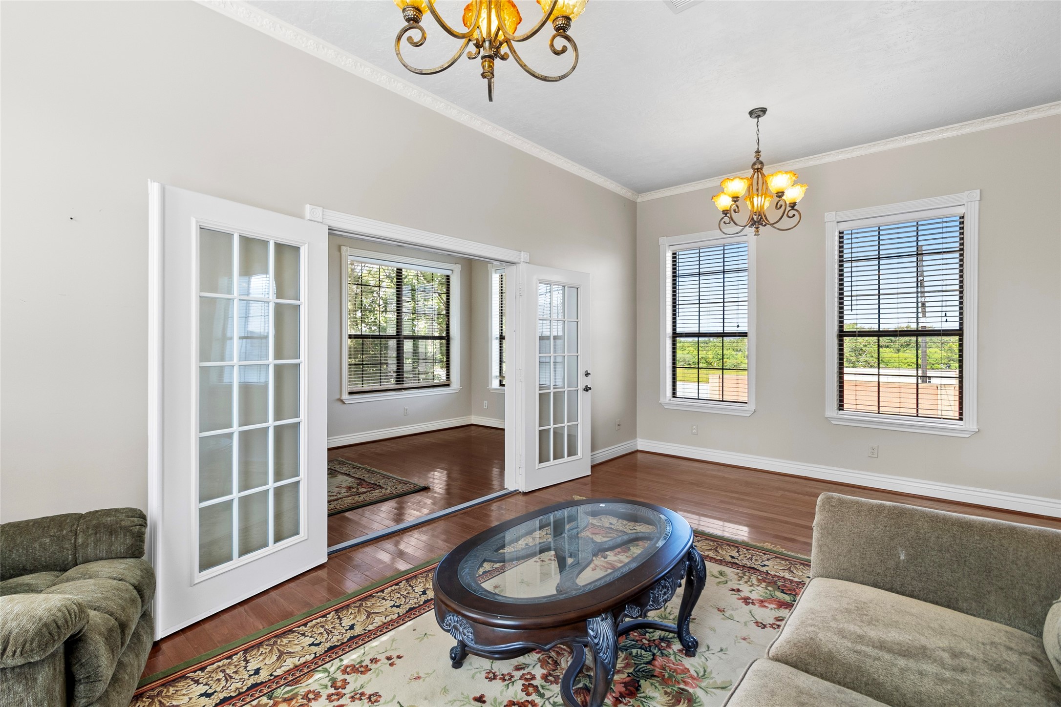 29315 Stockdick Road Katy, TX 77493 - Photo 29 of 50 a living room with furniture a chandelier and a window