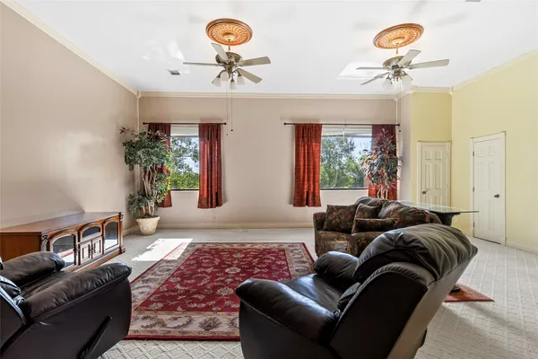 a bedroom with bed and a chandelier