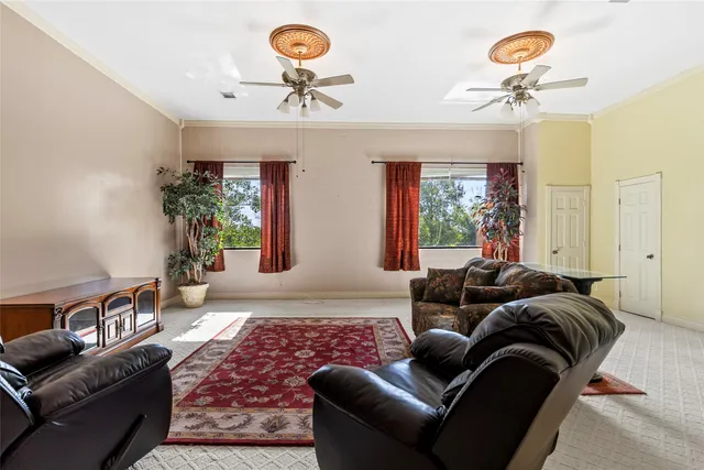 a bedroom with bed and a chandelier