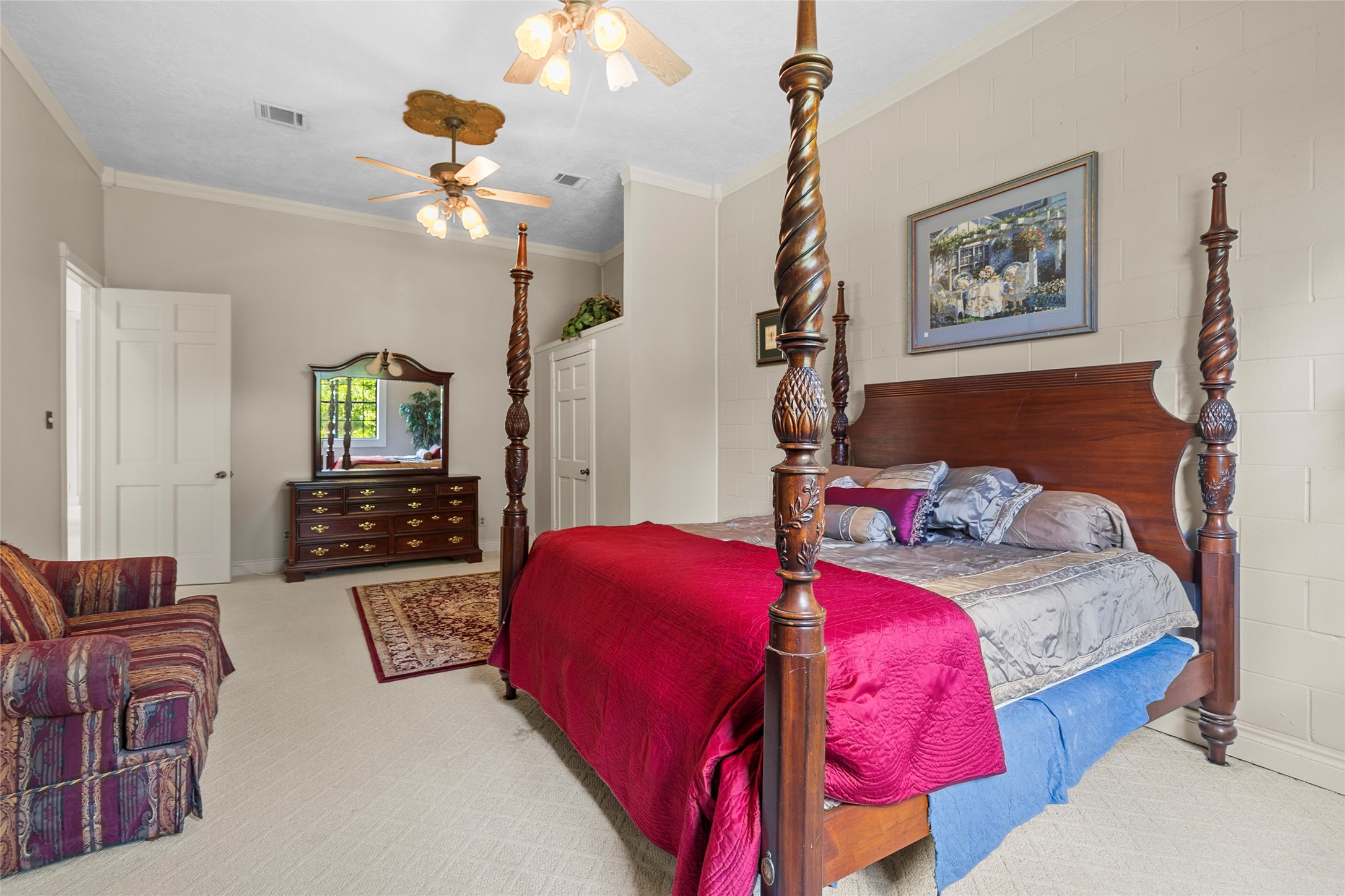 29315 Stockdick Road Katy, TX 77493 - Photo 32 of 50 a bedroom with bed and a chandelier