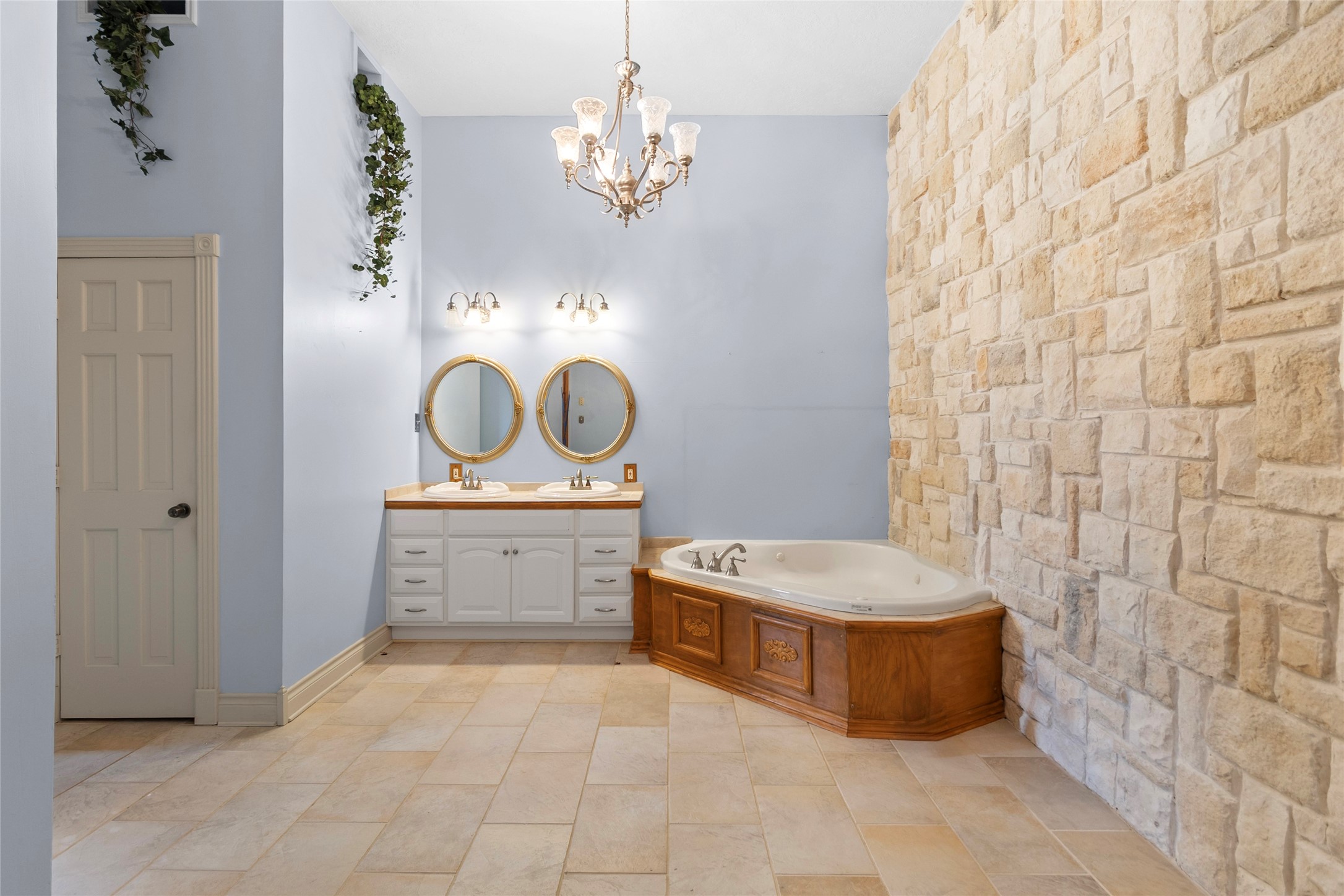 29315 Stockdick Road Katy, TX 77493 - Photo 33 of 50 a bathroom with a tub a sink and a mirror