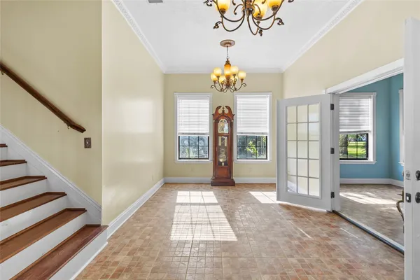 a view of an entryway with a chandelier