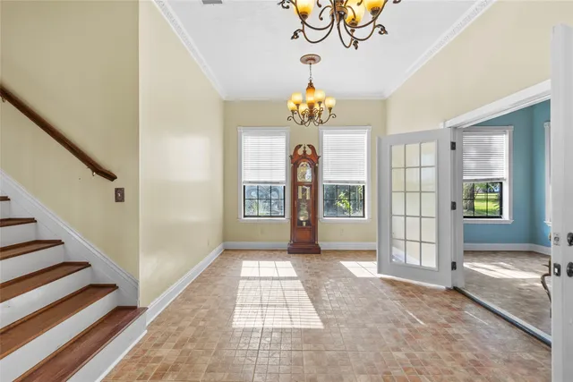a view of an entryway with a chandelier