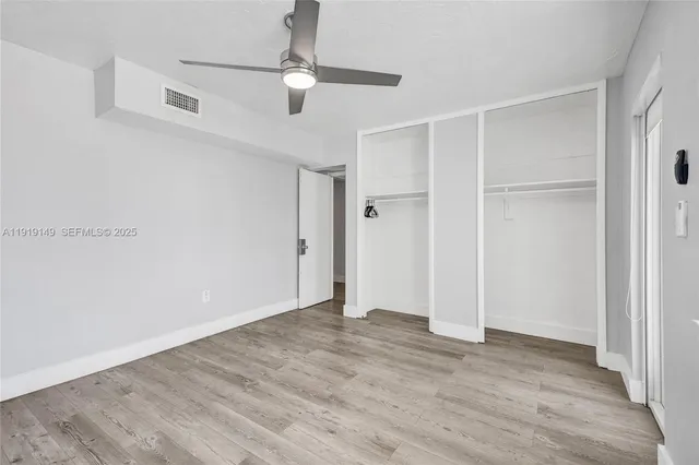a roof deck with furniture and a potted plant
